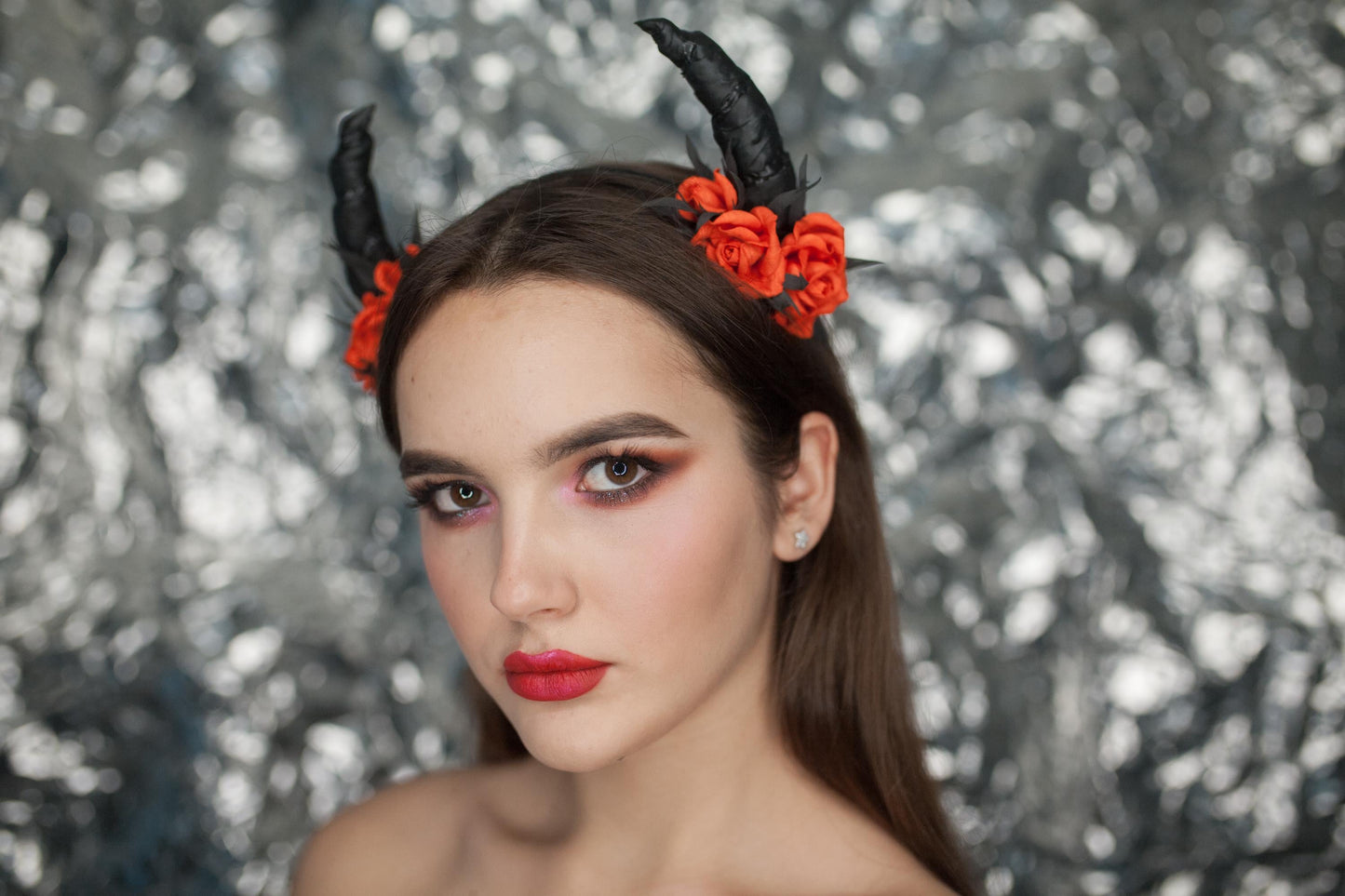 Black horns headband with red roses for Halloween party.