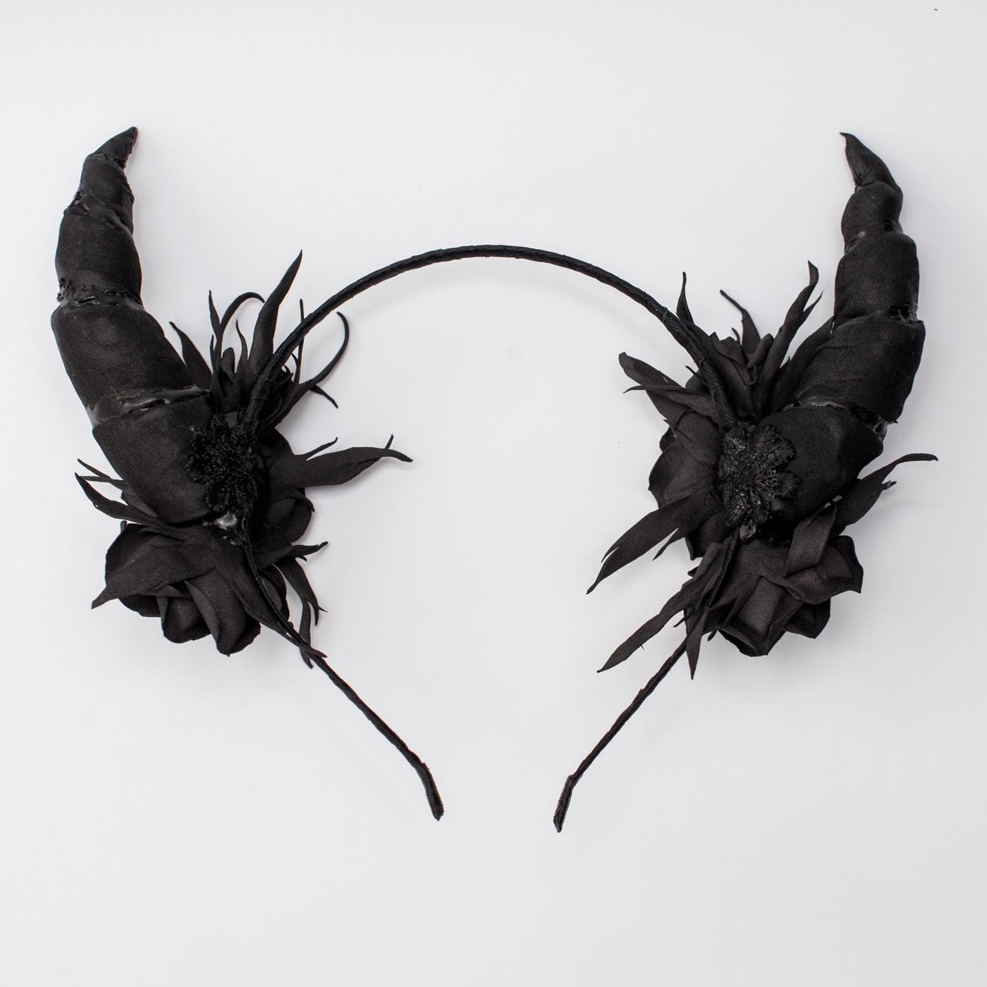 Black horns headband with roses for Halloween party.