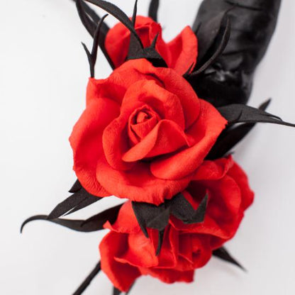 Black horns headband with red roses for Halloween party.
