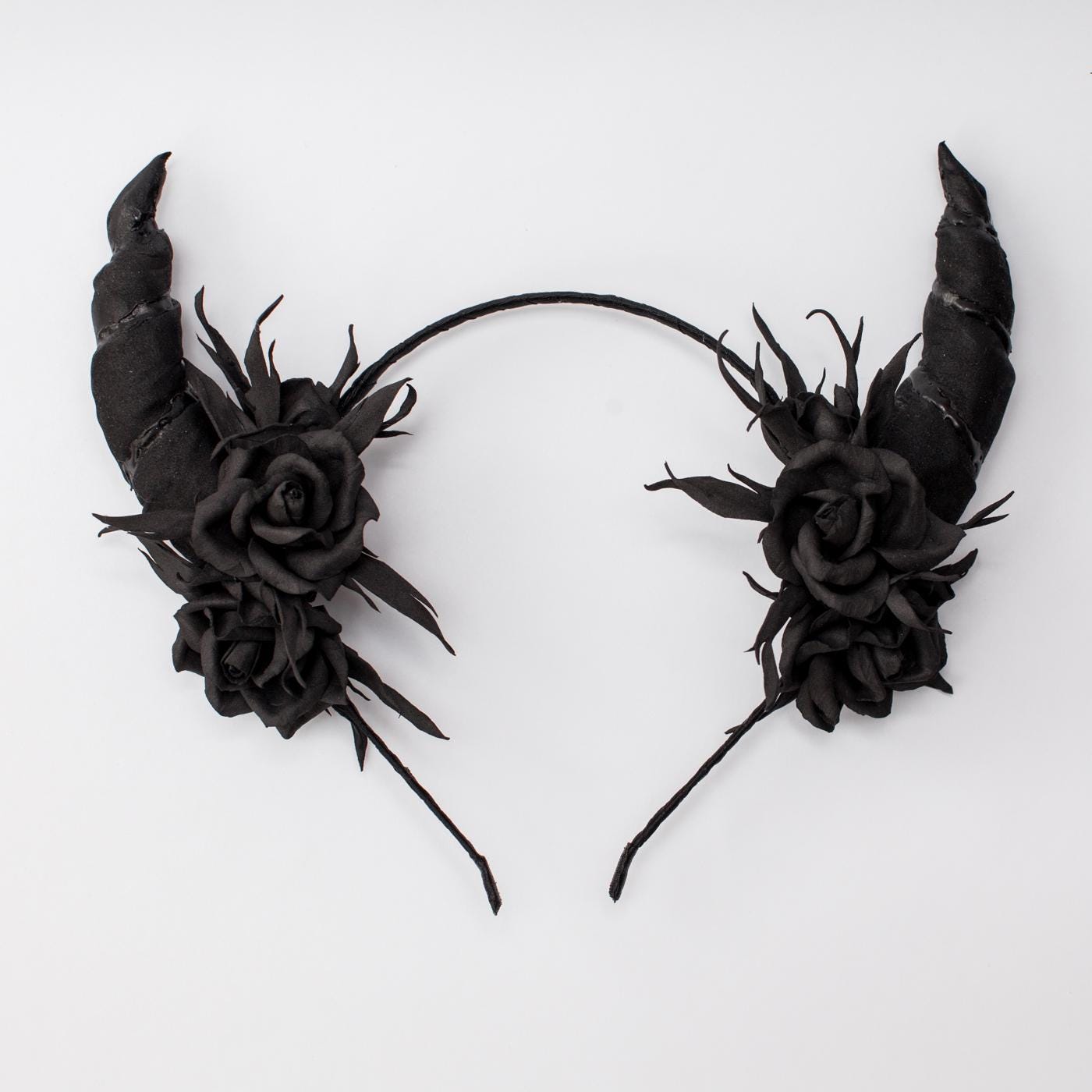 Black horns headband with roses for Halloween party.