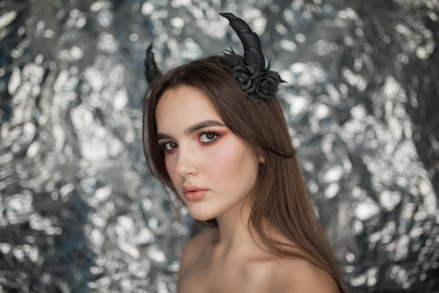 Black horns headband with roses for Halloween party.
