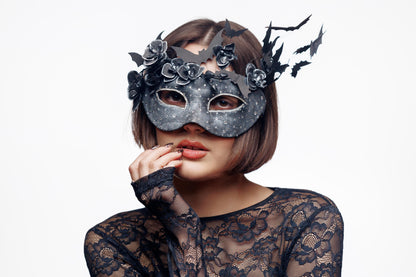 Black masquerade mask for woman with flying bat and flowers, rhinestones, textured finish.