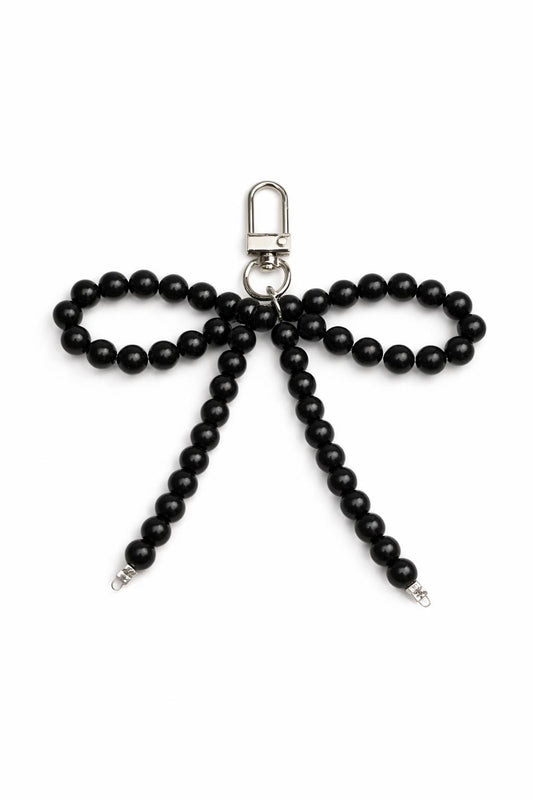 Black beaded bow keychain on a white background
