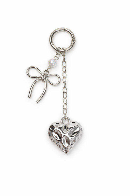 Cute silver heart keychain with bow charm. Lightweight key ring for keys or bags. Perfect small gift idea.