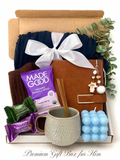 Gift box with various items including a mug, snacks, and a candle, labeled 'Premium Gift Box for Him' by Lederea US